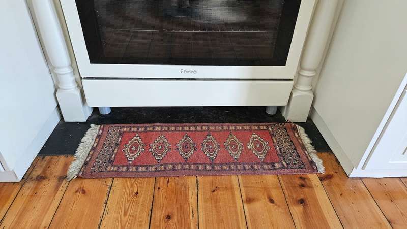 Small Persian rug.