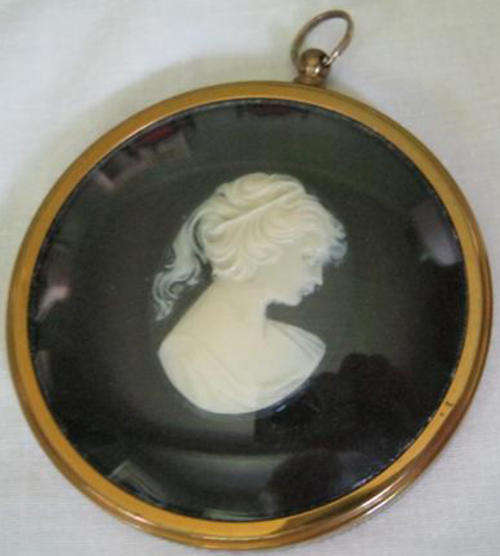 R1.00  PETER BATES, MINIATURE CAMEO, IN A  CIRCULAR BRASS FRAME MADE IN ENGLAND.