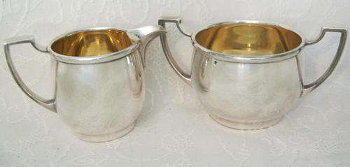 QUALITY AND  ELEGANT ELKINGTON SILVER PLATE MILK AND SUGAR BOWL THE INSIDES  HAVE BEEN GOLD WASHED..