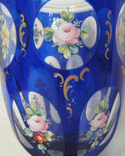 ANTIQUE, BOHEMIAN CRYSTAL VASE WITH HANDPAINTED, ENAMELED FLORAL PANELS.