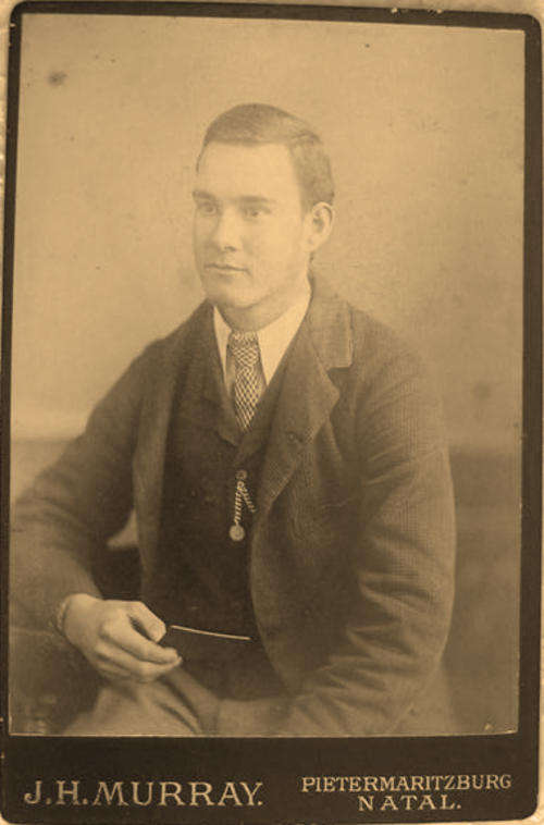 ANTIQUE STUDIO PHOTOGRAPH ON BOARD, OF A HANDSOME YOUNG MAN.