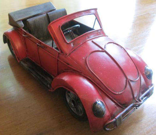 VINTAGE AND COLLECTABLE TOY VOLKSWAGEN CAR MADE FROM TINPLATE IN GOOD CONDITION.