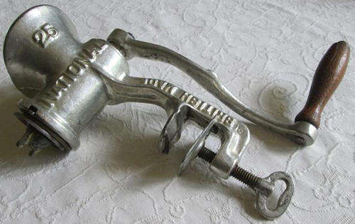 VINTAGE MINCER WITH A WOODEN HANDLE, MADE IN ENGLAND.