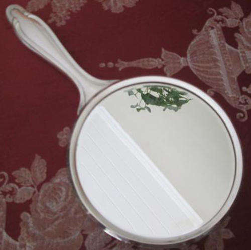 ART NOUVEAU DESIGN. SILVER PLATED HAND MIRROR AND MATCHING HAIR COMB BOTH IN GOOD CONDITION.