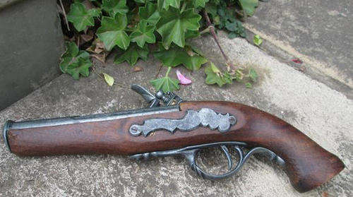 FLINTLOCK  REPLICA PISTOL ??? WOOD WITH METAL DETAIL. LENGTH 28cm