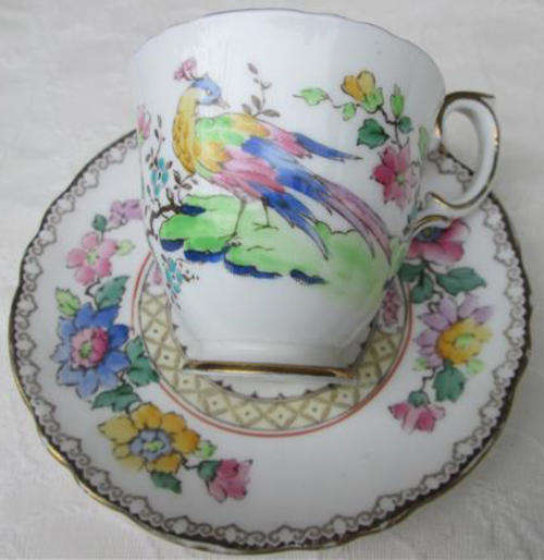 HAND PAINTED, CROWN STAFFORDSHIRE DEMITASSE CUP AND SAUCER