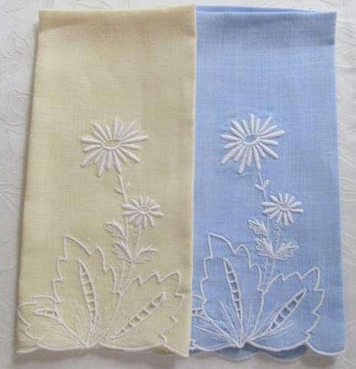 TWO VINTAGE COTTON LINEN, GUEST TOWELS, EMBROIDERED IN WHITE ON A BLUE AND YELLOW BACKGROUND