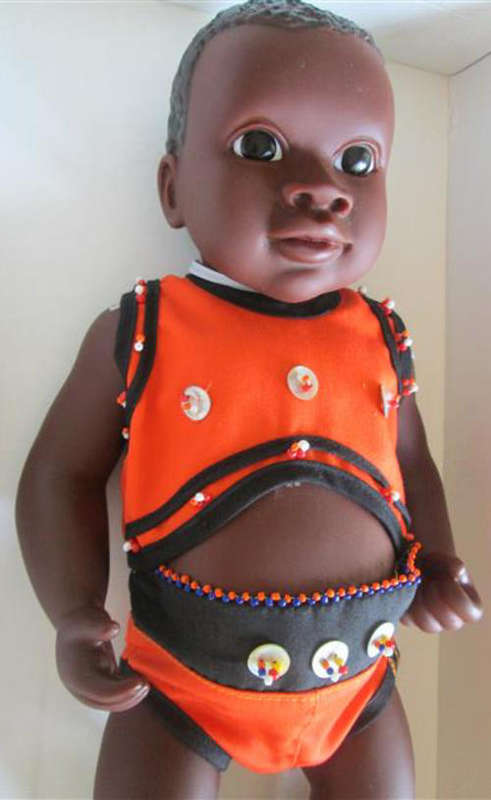 HIGHLY COLLECTABLE BLACK GIRL DOLL, MISS DELLA NAMED AFTER NELSON MANDELLA, MINT CONDITION.