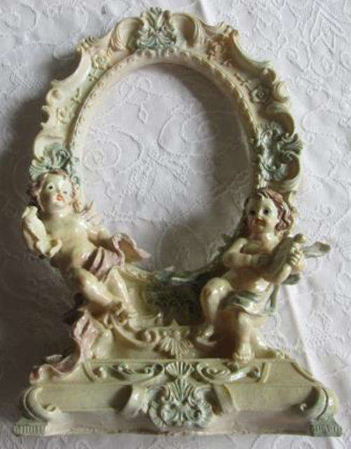 ROCOCCO STYLE, FIBRE CAST PICTURE / MIRROR FRAME DECORATED WITH CHERUBS.
