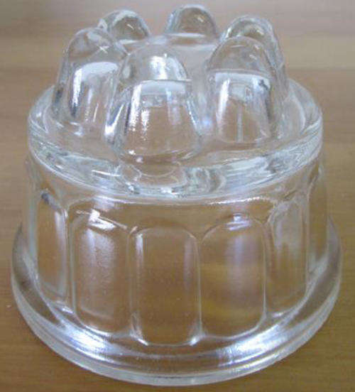 VINTAGE PRESSED SMALL GLASS JELLY MOLD, ROUND IN SHAPE.