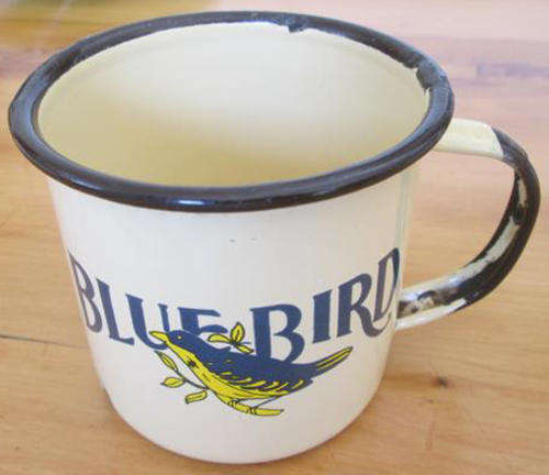 REDUCED TO SELL......VINTAGE ENAMEL MUG WITH AN ADVERT FOR BLUEBIRD ??