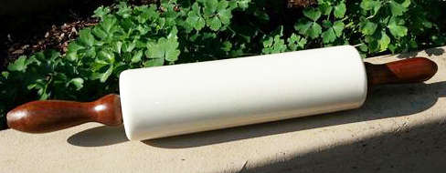 VINTAGE, NUT BROWN,  PORCELAIN ROLLING PIN MADE IN ENGLAND WITH REMOVABLE WOODEN HANDLES.