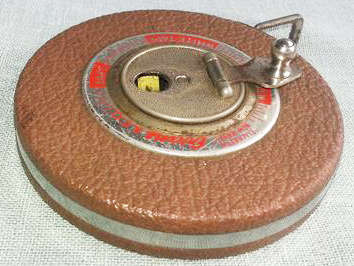 VINTAGE EVANS and CO 50 FOOT TAPE MEASURE, MADE IN ELIZABETH, NEW JERSEY