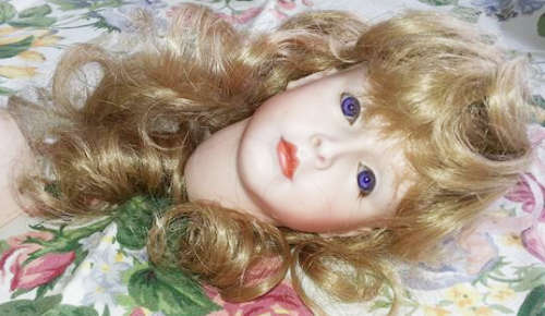 PORCELAIN DOLLS HEAD AND OTHER BODY PARTS
