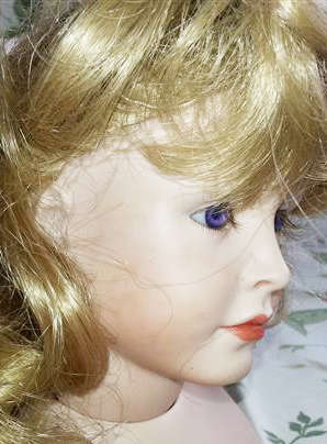 PORCELAIN DOLLS HEAD AND OTHER BODY PARTS