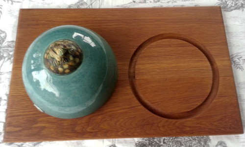 WOODEN CHEESE BOARD WITH TURNED POTTERY CHEESE DOME, MADE BY ZULU LULU