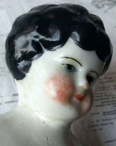 ANTIQUE, BLACK BERTHA ,PORCELAIN HEAD DOLL, LEGS AND ARMS PORCELAIN, SHE HAS A CLOTH BODY.
