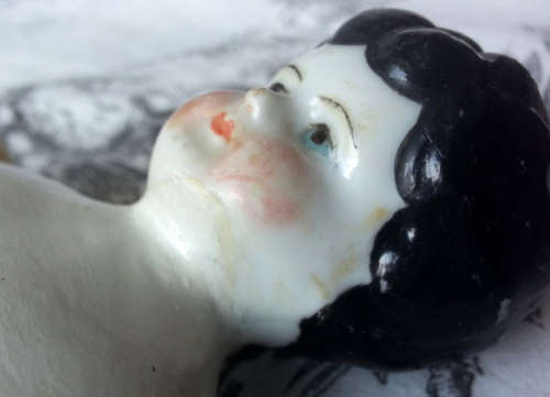 ANTIQUE, BLACK BERTHA ,PORCELAIN HEAD DOLL, LEGS AND ARMS PORCELAIN, SHE HAS A CLOTH BODY.
