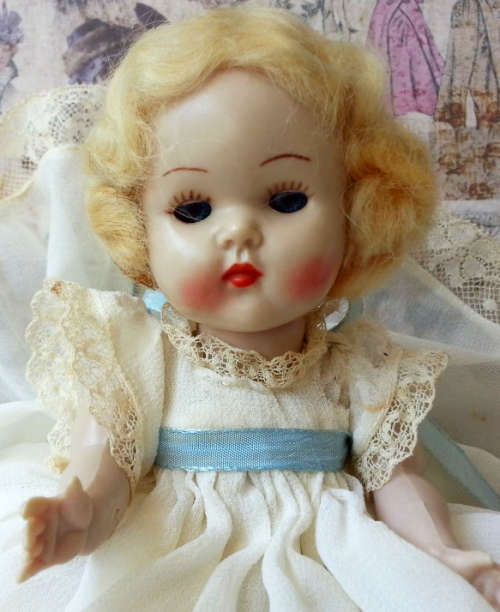 VINTAGE ROSEBUD BABY DOLL, BLONDE MOHAIR WIG, BLUE OPEN / SHUT EYES, ORIGINAL CLOTHING.