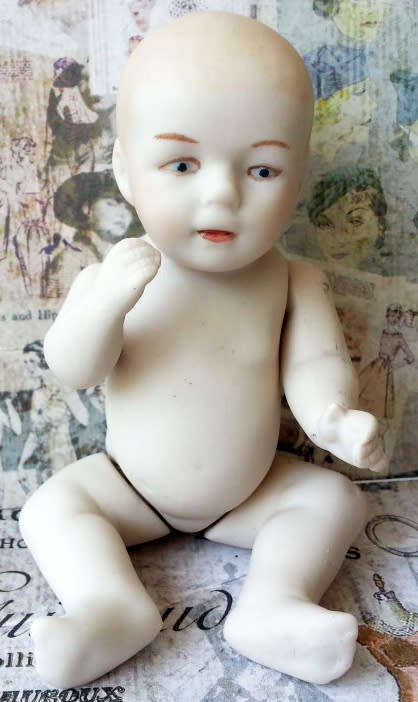 VINTAGE,  BISQUE MINI BABY DOLL WITH MOVING ARMS AND LEGS, NEEDING MOM TO SEW HIM / HER AN OUTFIT