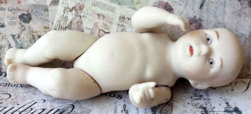 VINTAGE,  BISQUE MINI BABY DOLL WITH MOVING ARMS AND LEGS, NEEDING MOM TO SEW HIM / HER AN OUTFIT