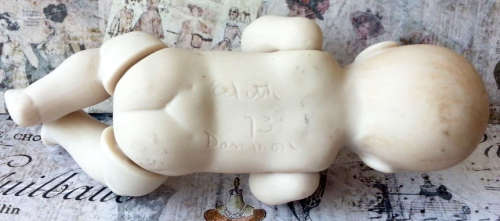 VINTAGE,  BISQUE MINI BABY DOLL WITH MOVING ARMS AND LEGS, NEEDING MOM TO SEW HIM / HER AN OUTFIT