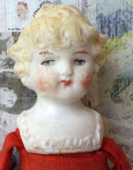 ANTIQUE, GERMAN SHOULDER HEAD, DOLL HOUSE DOLL,  WOOD FILLED BODY, BISQUE HEAD, HANDS AND FEET.