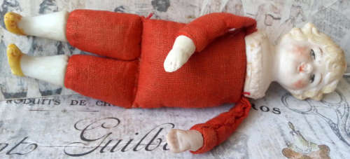 ANTIQUE, GERMAN SHOULDER HEAD, DOLL HOUSE DOLL,  WOOD FILLED BODY, BISQUE HEAD, HANDS AND FEET.