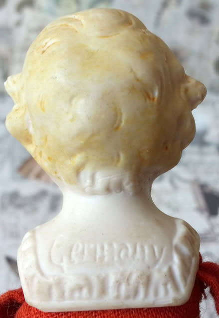 ANTIQUE, GERMAN SHOULDER HEAD, DOLL HOUSE DOLL,  WOOD FILLED BODY, BISQUE HEAD, HANDS AND FEET.
