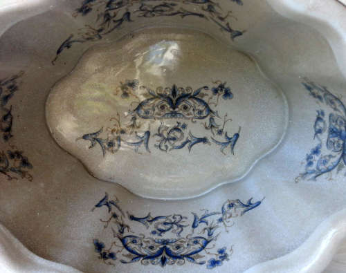 LARGE, HEAVY PORCELAIN, POT PLANT HOLDER WELL DECORATED WITH LEAVES, FLOWERS AND AN ANGEL OR TWO !!!