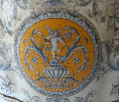 LARGE, HEAVY PORCELAIN, POT PLANT HOLDER WELL DECORATED WITH LEAVES, FLOWERS AND AN ANGEL OR TWO !!!