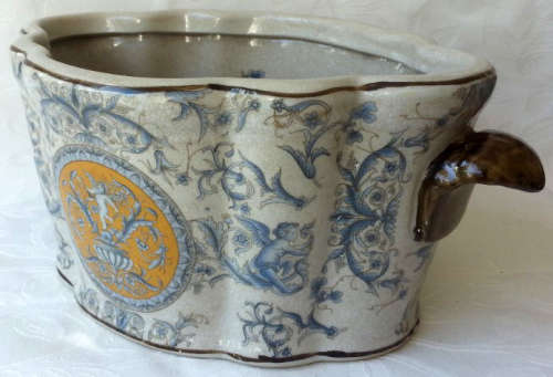 LARGE, HEAVY PORCELAIN, POT PLANT HOLDER WELL DECORATED WITH LEAVES, FLOWERS AND AN ANGEL OR TWO !!!