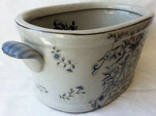 LARGE, HEAVY PORCELAIN, POT PLANT HOLDER WELL DECORATED WITH LEAVES, FLOWERS AND AN ANGEL OR TWO !!!