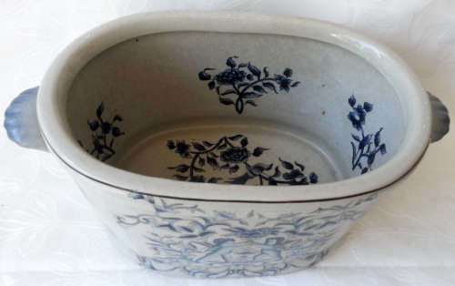 LARGE, HEAVY PORCELAIN, POT PLANT HOLDER WELL DECORATED WITH LEAVES, FLOWERS AND AN ANGEL OR TWO !!!