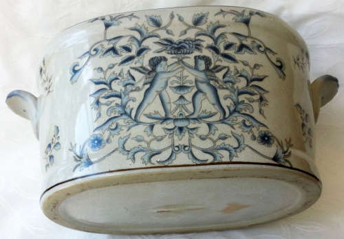 LARGE, HEAVY PORCELAIN, POT PLANT HOLDER WELL DECORATED WITH LEAVES, FLOWERS AND AN ANGEL OR TWO !!!