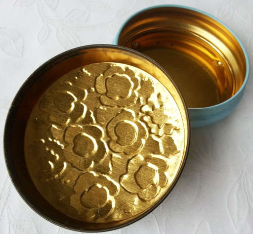 VINTAGE BISCUIT OR TOFFEE TIN, PRETTY EMBOSSED  WITH ROSES AND OTHER GARDEN FLOWERS