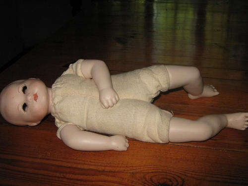 Doll 30cm. long -eyes have fallen into head -otherwise condition perfect