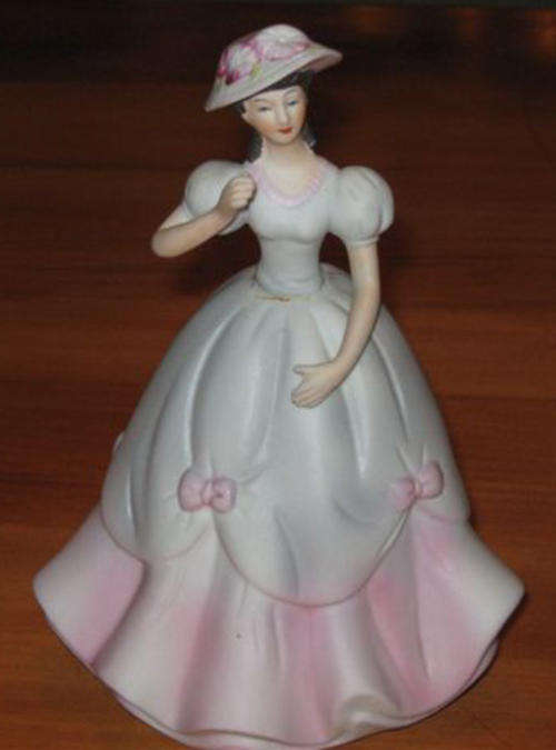 PRETTY YOUNG LADY DRESSED IN PINK AND BLUE, PLEASE NOTE DAMAGE.