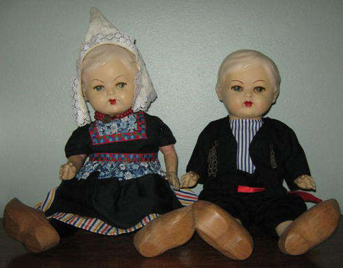 R250.00 !!! ANTIQUE PAIR OF DUTCH DOLLS, BISQUE HEAD, COMPOSITE LIMBS, STRAW STUFFED BODIES.