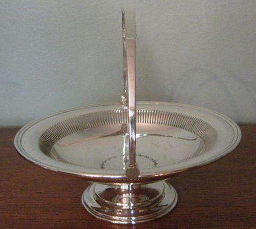 MAPPIN AND WEBB, SILVER PLATED CAKE BASKET WITH SWING HANDLE.
