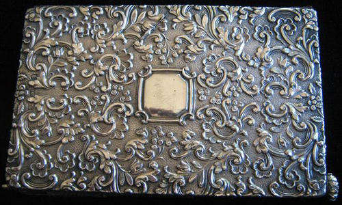 JAMES WOODS & SONS 1900s HALL MARKED SILVER BOOK WITH PROPELLING PENCIL, AND IVORY PAGES.
