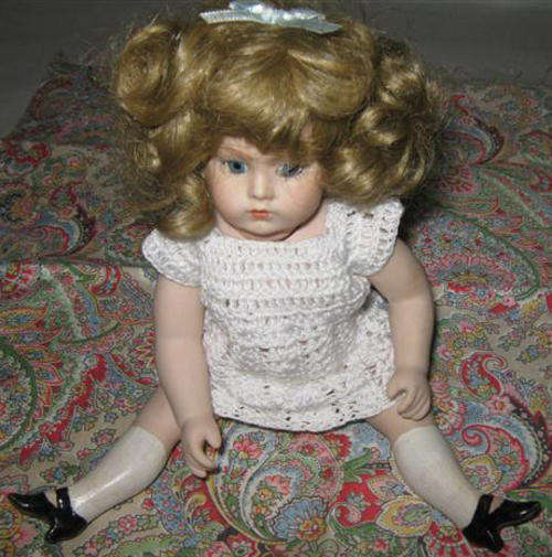 R1.00 VINTAGE PORCELAIN DOLL DRESSED IN HER CROCHET DRESS, PAINTED ON HIGH HEEL SHOES AND SOCKS.