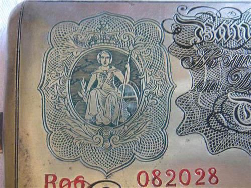 VINTAGE BRASS CIGARETTE CASE PRINTED WITH THE 1860 IMAGE OF THE BANK OF ENGLAND ONE POUND