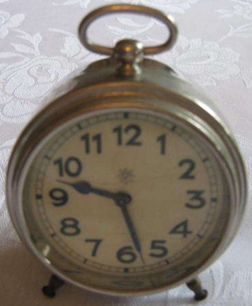 VINTAGE, BEDSIDE ALARM CLOCK IN WORKING CONDITION, GERMAN MADE.