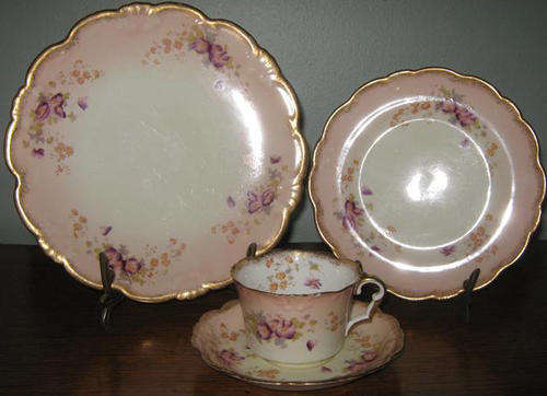 HANDPAINTED ANTIQUE TEA QUARTET,BY COLLINGWOOD ENGLAND, CONDITION GOOD BUT WITH A CHIP TO THE CUP.