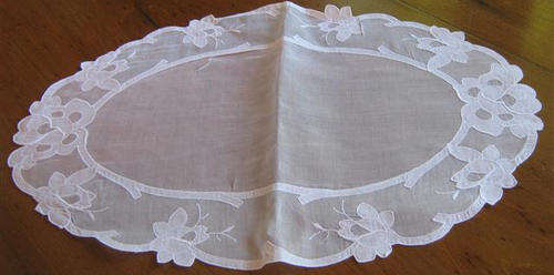 VINTAGE, OVAL SHAPED TRAY CLOTH MADE FROM VOILE, THE DESIGN IS APPLIQUED IN DOUBLE VOILE.