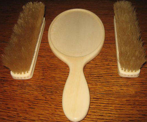 ANTIQUE IVORY, HAND MIRROR WITHOUT GLASS AND SET OF 2 IVORY CLOTHES BRUSHES.