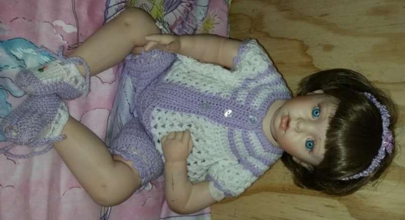 A PORCELAIN DOLL TO ADD TO YOUR COLLECTION