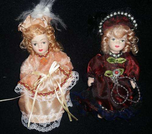 SET OF 2 SMALL VINTAGE PORCELAIN DOLLS