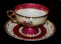 Footed Tea Cup and Saucer with cut out lace design
